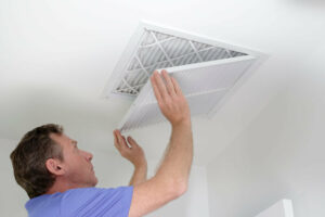 man replacing air ducts